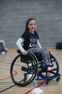 Young wheelchair basketball player smiling
